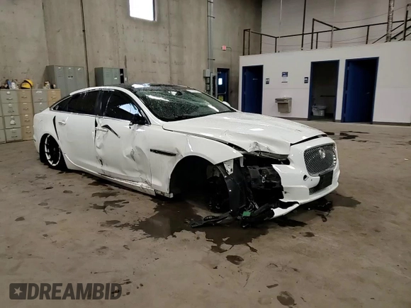 2014 Jaguar XJ Portfolio with VIN SAJWJ2GD2E8V69597, listed as a Copart auction lot 57798145 with 100,857 mi miles and Salvage title. Bid and sale history available at DreamBid. Image 14.
