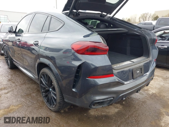 2022 BMW X6 xDrive40i z VIN 5UXCY6C08N9N30013, wystawiony jako IAAI lot #41772245 z przebiegiem 23 198 mil mil oraz . Historia ofert i sprzedaży dostępna na DreamBid. Obrazek 3.