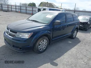 2014 Dodge Journey American Value Pkg with VIN 3C4PDCAB7ET101132, listed as a IAAI auction lot 41802381 with 101,895 mi miles. Bid and sale history available at carsss.com. Image 2.