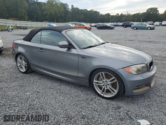 2012 BMW 1 Series 135i with VIN WBAUN7C59CVM26082, listed as a Copart auction lot 74711754 with 77,152 mi miles and Salvage title. Bid and sale history available at DreamBid. Image 4.