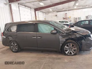 2014 Honda Odyssey Touring with VIN 5FNRL5H99EB105059, listed as a IAAI auction lot 42457672 with 240,581 mi miles and . Bid and sale history available at DreamBid. Image 13.