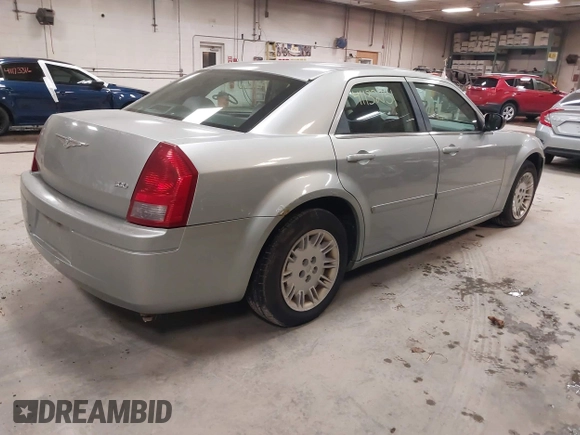 2005 Chrysler 300 with VIN 2C3JA43R55H569369, listed as a IAAI auction lot 41132751 with 123,253 mi miles. Bid and sale history available at carsss.com. Image 4.