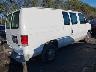 1999 Ford Econoline Cargo Commercial with VIN 1FTNE24L6XHB25183, listed as a IAAI auction lot 41391984 with 205,804 mi miles and . Bid and sale history available at carsss.com. Image 4.