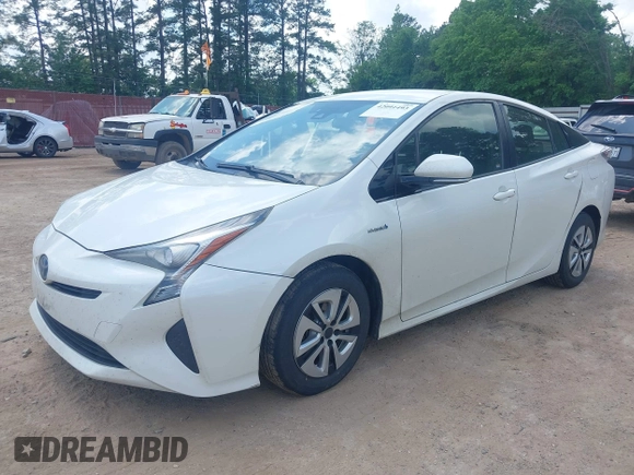 2017 Toyota Prius Two with VIN JTDKARFUXH3040780, listed as a IAAI auction lot 42091493 with 105,952 mi miles and . Bid and sale history available at DreamBid. Image 2.