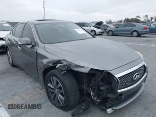 2015 Infiniti Q50 Premium with VIN JN1BV7AP6FM357265, listed as a IAAI auction lot 42104440 with 83,404 mi miles. Bid and sale history available at carsss.com. Image 1.