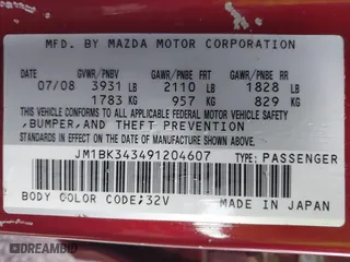 2009 Mazda Mazda3 s Touring with VIN JM1BK343491204607, listed as a IAAI auction lot 41488515 with 117,634 mi miles. Bid and sale history available at carsss.com. Image 9.