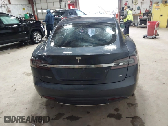 2014 Tesla Model S 60 with VIN 5YJSA1H16EFP52853, listed as a IAAI auction lot 41941989 with 132,038 mi miles and . Bid and sale history available at DreamBid. Image 16.