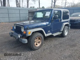 2005 Jeep Wrangler Sport with VIN 1J4FA49S25P302627, listed as a IAAI auction lot 42100601 with 169,650 mi miles. Bid and sale history available at carsss.com. Image 2.