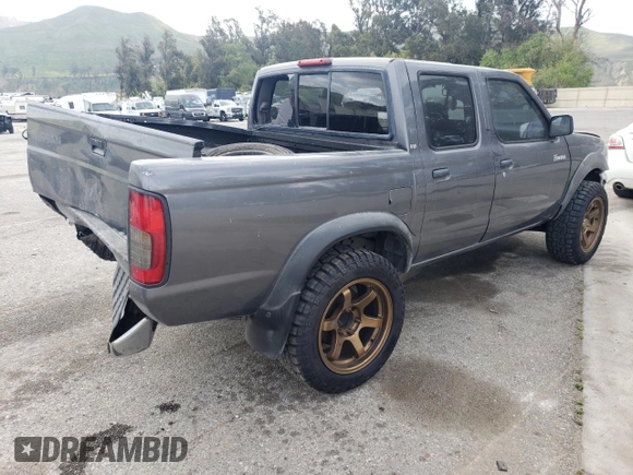 2000 Nissan Frontier XE with VIN 1N6ED27T5YC426456, listed as a Copart auction lot 54411425 with 117,600 mi miles and Salvage title. Bid and sale history available at DreamBid. Image 3.