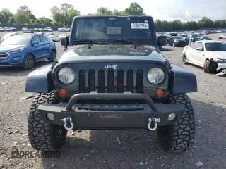2011 Jeep Wrangler Sahara with VIN 1J4AA5D15BL552185, listed as a Copart auction lot 63065185 with 159,850 mi miles and Salvage title. Bid and sale history available at DreamBid. Image 5.