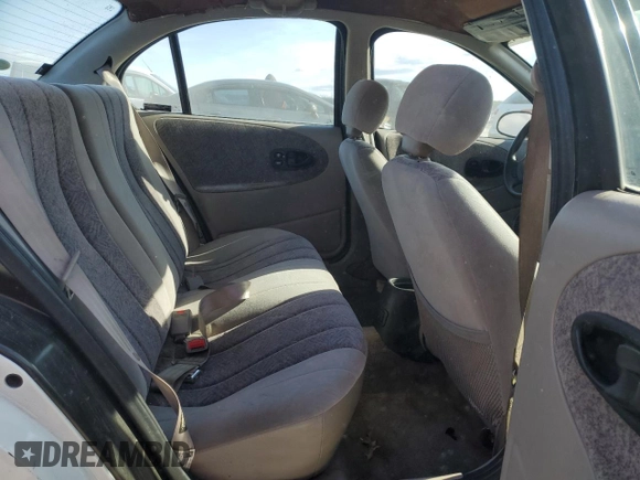 1996 Saturn SL with VIN 1G8ZK5279TZ162812, listed as a Copart auction lot 87079874 with 143,461 mi miles and Salvage title. Bid and sale history available at DreamBid. Image 10.