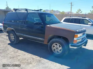 1997 Chevrolet Tahoe with VIN 3GNEK18RXVG147235, listed as a IAAI auction lot 41881750 with 184,629 mi miles. Bid and sale history available at carsss.com. Image 1.