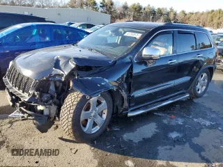2013 Jeep Grand Cherokee Overland with VIN 1C4RJFCTXDC525097, listed as a Copart auction lot 42250875 with 214,368 mi miles and Salvage Title. Bid and sale history available at carsss.com. Image 1.