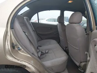 2002 Kia Rio with VIN KNADC123626192611, listed as a IAAI auction lot 41765104 with 62,387 mi miles. Bid and sale history available at carsss.com. Image 8.