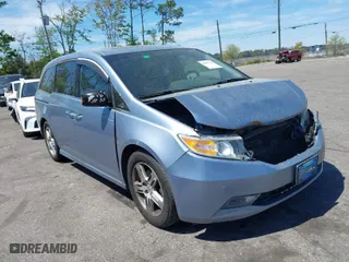2013 Honda Odyssey Touring with VIN 5FNRL5H94DB069716, listed as a IAAI auction lot 41901369 with 243,492 mi miles. Bid and sale history available at carsss.com. Image 1.