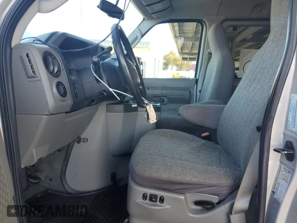 2010 Ford Econoline Passenger XL with VIN 1FMNE1BW3ADA25124, listed as a Copart auction lot 56899235 with 244,010 mi miles and Salvage title. Bid and sale history available at DreamBid. Image 7.