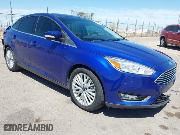 2015 Ford Focus Titanium with VIN 1FADP3J25FL314903, listed as a IAAI auction lot 42053132 with 125,418 mi miles and . Bid and sale history available at carsss.com. Image 1.