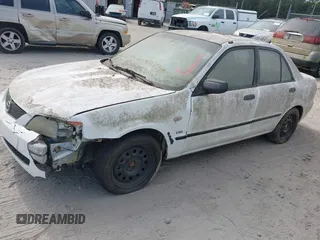 2003 Mazda Protege DX with VIN JM1BJ225730146488, listed as a IAAI auction lot 42086747 with Not Provided miles and . Bid and sale history available at DreamBid. Image 2.