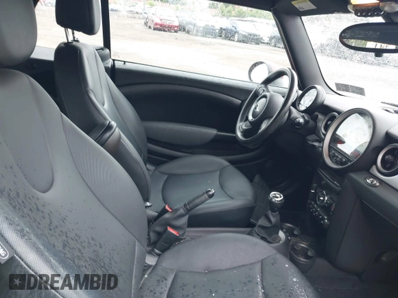 2011 MINI Convertible with VIN WMWZN3C59BTZ89447, listed as a IAAI auction lot 42313009 with 62,009 mi miles and . Bid and sale history available at DreamBid. Image 5.