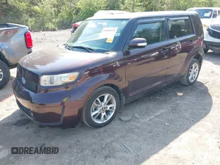 2010 Scion xB with VIN JTLZE4FE7A1101670, listed as a IAAI auction lot 42009413 with 165,418 mi miles. Bid and sale history available at carsss.com. Image 2.