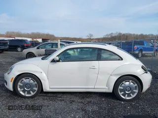 2014 Volkswagen Beetle 2.5L w/Sun with VIN 3VWJP7AT8EM611560, listed as a IAAI auction lot 41488488 with 140,798 mi miles and . Bid and sale history available at DreamBid. Image 15.