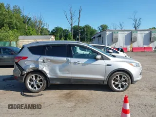 2016 Ford Escape Titanium with VIN 1FMCU9J97GUB91966, listed as a IAAI auction lot 42378829 with 121,218 mi miles and . Bid and sale history available at DreamBid. Image 13.