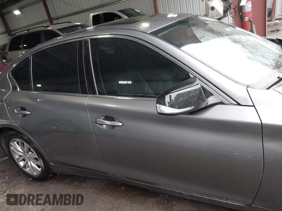 2015 Infiniti Q50 Premium z VIN JN1BV7ARXFM411040, wystawiony jako IAAI lot #41706295 z przebiegiem 97 297 mil mil oraz . Historia ofert i sprzedaży dostępna na DreamBid. Obrazek 13.