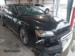 2012 Audi A8 with VIN WAUAVAFD9CN006499, listed as a IAAI auction lot 42461402 with 57,232 mi miles and . Bid and sale history available at DreamBid. Image 1.