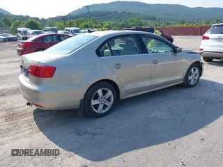 2014 Volkswagen Jetta TDI w/Premium with VIN 3VW3L7AJ3EM319365, listed as a IAAI auction lot 42479875 with 133,068 mi miles and . Bid and sale history available at DreamBid. Image 4.