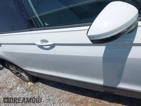 2018 Volkswagen Tiguan S with VIN 3VV1B7AX8JM032990, listed as a IAAI auction lot 42279807 with 74,185 mi miles and . Bid and sale history available at DreamBid. Image 14.