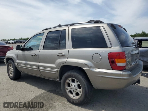 1999 Jeep Grand Cherokee Limited with VIN 1J4GW68N4XC663476, listed as a Copart auction lot 52449925 with 174,583 mi miles and Salvage Title. Bid and sale history available at carsss.com. Image 2.