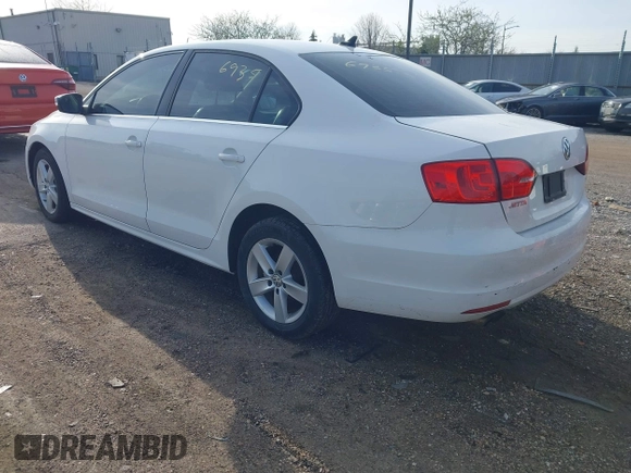 2013 Volkswagen Jetta TDI w/Premium with VIN 3VWLL7AJ6DM422102, listed as a IAAI auction lot 41956935 with 143,385 mi miles and . Bid and sale history available at DreamBid. Image 3.