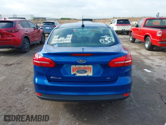 2018 Ford Focus SE z VIN 1FADP3F2XJL293337, wystawiony jako IAAI lot #42121294 z przebiegiem 71 241 mil mil oraz . Historia ofert i sprzedaży dostępna na DreamBid. Obrazek 16.