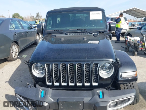 2023 Jeep Wrangler Sahara with VIN 1C4JJXP67PW556933, listed as a IAAI auction lot 41587035 with 20,463 mi miles and . Bid and sale history available at DreamBid. Image 12.