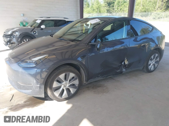 2023 Tesla Model Y Long Range with VIN 7SAYGAEE4PF906577, listed as a IAAI auction lot 42174987 with 13,260 mi miles and . Bid and sale history available at DreamBid. Image 17.