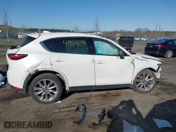 2020 Mazda CX-5 Grand Touring with VIN JM3KFBDM6L0751471, listed as a IAAI auction lot 41914849 with Not Provided miles and . Bid and sale history available at carsss.com. Image 13.