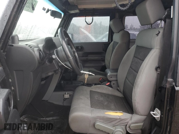 2008 Jeep Wrangler X z VIN 1J8FA24168L646281, wystawiony jako Copart lot #57689895 z przebiegiem 205 348 mil mil oraz Szkoda całkowita • Salvage title. Historia ofert i sprzedaży dostępna na DreamBid. Obrazek 7.