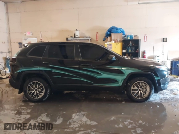2015 Jeep Cherokee Sport with VIN 1C4PJMAB6FW773953, listed as a IAAI auction lot 41565879 with 242,580 mi miles. Bid and sale history available at carsss.com. Image 13.