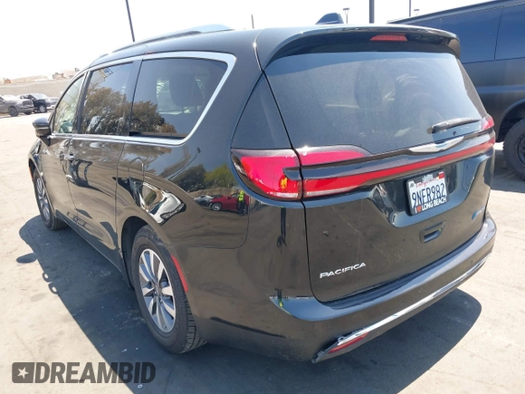 2021 Chrysler Pacifica Hybrid Touring L with VIN 2C4RC1L71MR599631, listed as a IAAI auction lot 42151965 with 67,401 mi miles and . Bid and sale history available at DreamBid. Image 3.