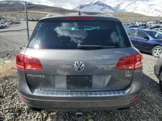 2014 Volkswagen Touareg Lux z VIN WVGEF9BP1ED007974, wystawiony jako Copart lot #82627834 z przebiegiem Nie podano mil oraz Szkoda całkowita • Salvage title. Historia ofert i sprzedaży dostępna na DreamBid. Obrazek 6.