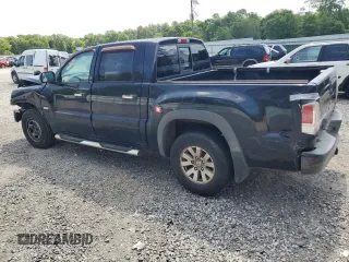 2006 Mitsubishi Raider Duro Cross z VIN 1Z7HC38K26S576434, wystawiony jako Copart lot #53798965 z przebiegiem 198 820 mil mil oraz Szkody całkowita. Historia ofert i sprzedaży dostępna na DreamBid. Obrazek 2.