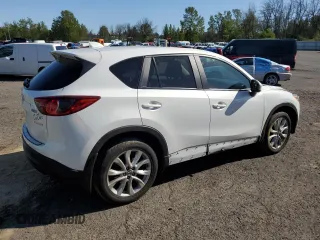 2014 Mazda CX-5 Grand Touring with VIN JM3KE4DY2E0354795, listed as a Copart auction lot 54205775 with 62,939 mi miles and Salvage Title. Bid and sale history available at DreamBid. Image 3.