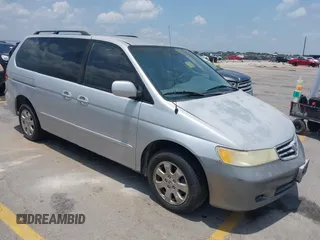 2002 Honda Odyssey EX z VIN 2HKRL18692H573692, wystawiony jako IAAI lot #42444637 z przebiegiem 262 737 mil mil oraz . Historia ofert i sprzedaży dostępna na DreamBid. Obrazek 1.