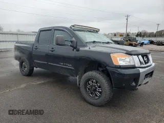 2014 Nissan Titan Pro-4X with VIN 1N6AA0EC3EN514744, listed as a Copart auction lot 80469314 with 191,780 mi miles and Salvage title. Bid and sale history available at DreamBid. Image 4.