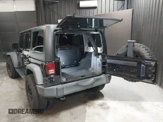 2015 Jeep Wrangler Unlimited Willys Wheeler with VIN 1C4BJWDG1FL749803, listed as a IAAI auction lot 41995132 with 156,595 mi miles and . Bid and sale history available at DreamBid. Image 3.