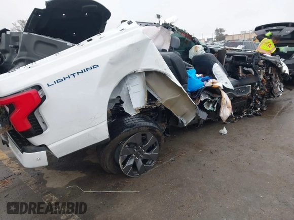 2023 Ford F-150 Lightning Pro with VIN 1FT6W1EV8PWG05765, listed as a IAAI auction lot 41461450 with Not Provided miles and . Bid and sale history available at DreamBid. Image 4.