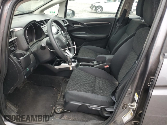 2015 Honda Fit LX z VIN 3HGGK5H58FM785137, wystawiony jako Copart lot #59013315 z przebiegiem 84 592 mil mil oraz Szkoda całkowita • Salvage title. Historia ofert i sprzedaży dostępna na DreamBid. Obrazek 7.