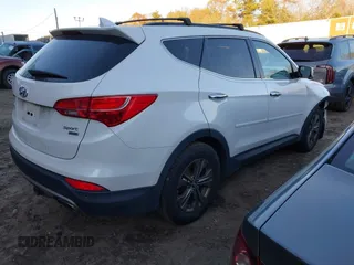 2014 Hyundai Santa Fe with VIN 5XYZUDLB4EG129473, listed as a IAAI auction lot 40978108 with 169,997 mi miles and . Bid and sale history available at DreamBid. Image 4.
