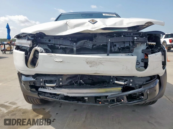 2025 Rivian R1S Adventure z VIN 7PDSGBBA3SN046975, wystawiony jako Copart lot #61790405 z przebiegiem 8 427 mil mil oraz Szkoda całkowita • Salvage title. Historia ofert i sprzedaży dostępna na DreamBid. Obrazek 5.