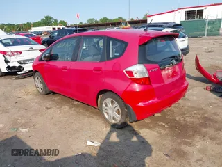 2009 Honda Fit z VIN JHMGE88219S023503, wystawiony jako IAAI lot #42376165 z przebiegiem 142 166 mil mil oraz . Historia ofert i sprzedaży dostępna na DreamBid. Obrazek 3.